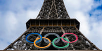 The logo of the Olympic Games on display at the Eiffel Tower