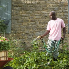 Man holding a garden hose