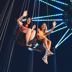 Friends on chain swing ride