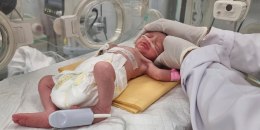 A Palestinian baby girl, Sabreen Jouda, who was delivered prematurely after her mother was killed in an Israeli strike along with her husband and daughter, lies in an incubator in the Emirati hospital in Rafah, southern Gaza , on April 21, 2024.