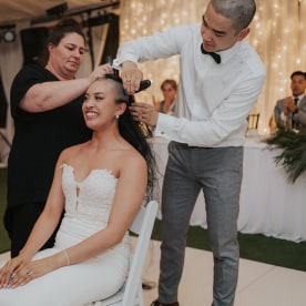 Couple shaving their hair during their wedding