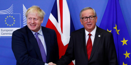 Image: European Commission President Jean-Claude Juncker and Britain's Prime Minister Boris Johnson shake hands during a news conference after agreeing on the Brexit deal