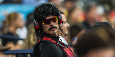Dr DisRespect sits in the stands during a Padres game in San Diego.