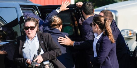 Secret Service agents surround a car