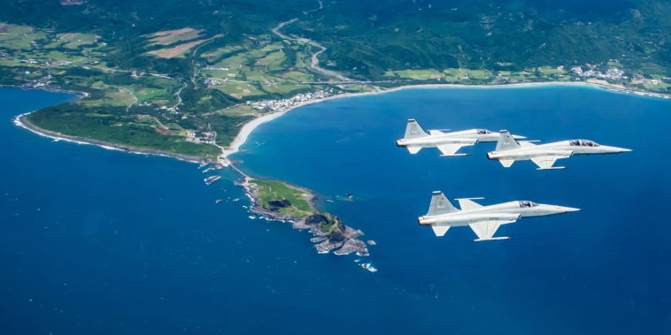 Pilots from the 7th Wing Air Base in Taitung practice their skills during a daily training flight near the eastern coast of Taiwan.