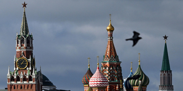 The Kremlin's Spasskaya tower, left, and Saint Basil's cathedral in Moscow.