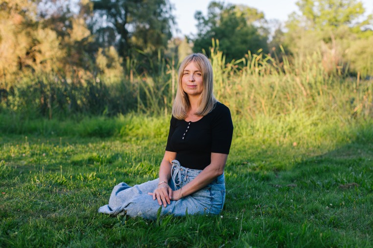 Jennifer Nosek sitting on the grass