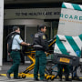 Emergency personnel load an ambulance in front of Mount Sinai Hospital in New York on Jan. 12, 2023. 