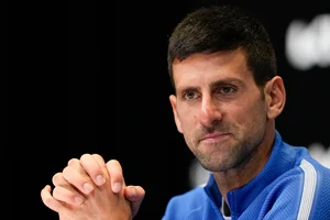 (AP Photo/Louise Delmotte) : Novak Djokovic of Serbia reacts during a press conference following his loss to Jannik Sinner of Italy in their semifinal at the Australian Open tennis championships at Melbourne Park, Melbourne, Australia, Friday, Jan. 26, 2024. 