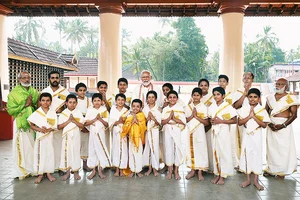 Photo: PIB : Prime Minister Narendra Modi with artists who performed the Malayalam Ramayana in Kerala's Thrissur district.