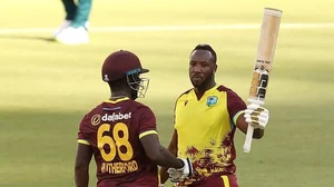 ICC Photo : Andre Russell (right) smashed 29-ball 71 against Australia.