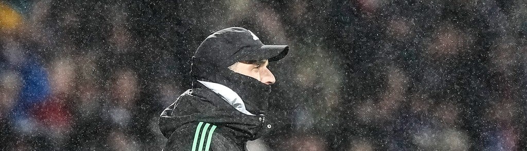 AP : Bayern Munich's head coach Thomas Tuchel stands in the rain during their German Bundesliga football match against VfL Bochum in Bochum on February 18, 2024. Bochum defeated Bayern 3-2.