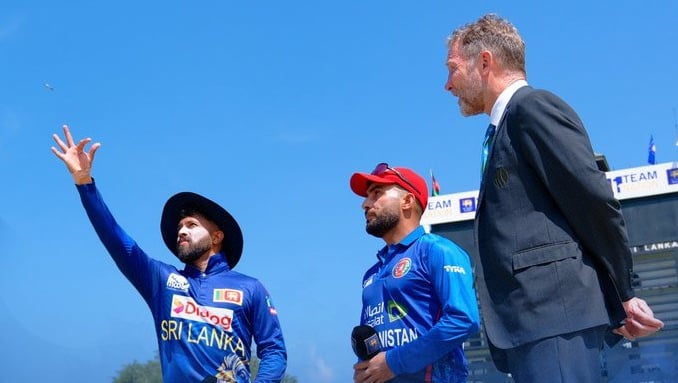 Photo - X/OfficialSLC : Sri Lanka skipper Kusal Mendis (left) at the toss with his Afghanistani counterpart Hashmatullah Shahidi.