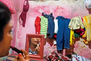 Photo: Sandipan Chatterjee : Despite Odds: Renuka gets ready for work in her room in Sonagachi, Kolkata