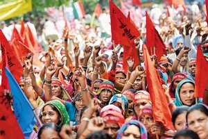 Photo: Getty Images : Demanding Equal Rights:
Adivasi villagers at the Bhumi Adhikar Andolan rally against land acquisition held in New Delhi