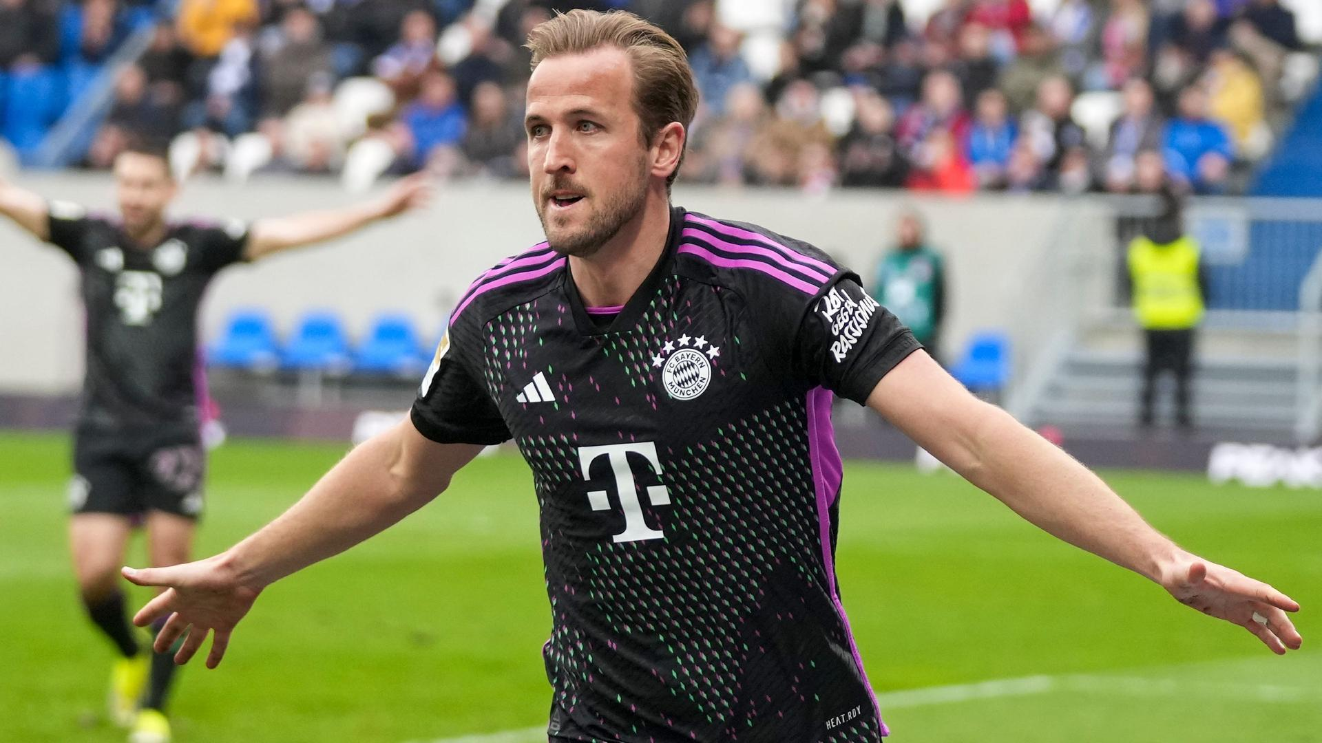 Michael Probst/AP : Harry Kane set a new Bundesliga record with his 31st goal in the German top flight.