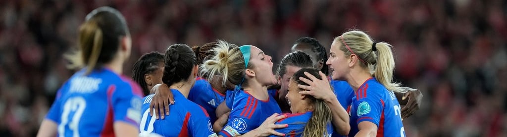 AP : Lyon's Delphine Cascarino, third from right, celebrates with her teammates after scoring a goal against Benfica during their UEFA Women's Champions League quarter-final, first leg match at the Luz Stadium in Lisbon, Portugal on March 19, 2024.