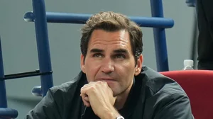 AP File : Retired tennis player Roger Federer watches the men's singles quarterfinal match between Andrey Rublev of Russia and Ugo Humbert of France in the Shanghai Masters at Qizhong Forest Sports City Tennis Center in Shanghai, China on October 13, 2023.