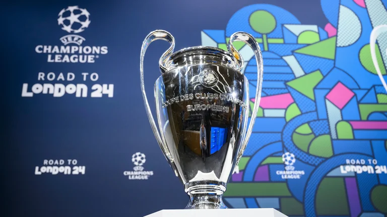 The Champions League trophy is pictured during the quarter-final draw of the UEFA Champions League 2023/24. - Photo: Jean-Christophe Bott/Keystone via AP