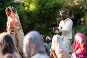 The Wedding Filmer Team : Wedding filmmaker Vishal Punjabi capturing a bridal entry.