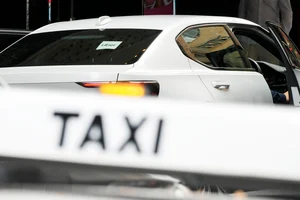 Rick Rycroft/ AP : Uber Lawsuit in Australia