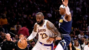 LeBron James #23 of the Los Angeles Lakers drives to the basket against Peyton Watson #8 of the Denver Nuggets in the first half of game 4 of a first round NBA playoff basketball game at Crypto.com Arena in Los Angeles on Saturday, April 27, 2024.