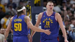 Aaron Gordon #50 and Nikola Jokic #15 of the Denver Nuggets celebrate their win against the Los Angeles Lakers during game one of the Western Conference First Round Playoffs at Ball Arena on April 20, 2024