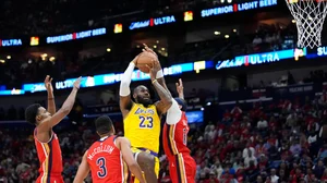 Gerald Herbert/AP : LeBron James goes for a basket.