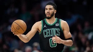 File : Jayson Tatum #0 of the Boston Celtics brings the ball up court in the third quarter during their game against the Charlotte Hornets at Spectrum Center on April 01, 2024.