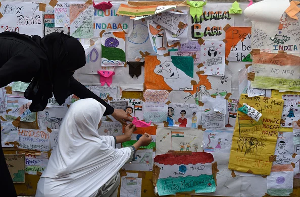 Students draw painting while Muslim women stage a Shaheen Bagh like protest against CAA and NRC at Mumbai central, on February 4, 2020 in Mumbai, India.  - Getty Images