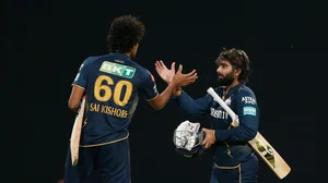 AP : Gujarat Titans' Rahul Tewatia , right, and his batting partner Sai Kishore celebrate their team's win over Punjab Kings in the Indian Premier League cricket match between Punjab Kings' and Gujarat Titans' in Mullanpur