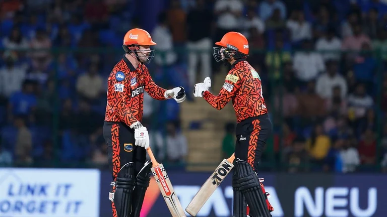 Travis Head (left) and Abhishek Sharma bump fists during the Indian Premier League 2024 match between Delhi Capitals and Sunrisers Hyderabad in New Delhi on Saturday, April 20.  - AP