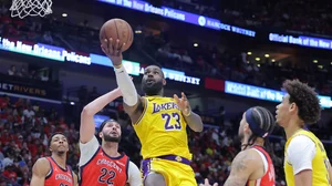 LeBron James (#23) of the Los Angeles Lakers shoots against Larry Nance Jr. (#22) of the New Orleans Pelicans during the second half of a play-in tournament game at the Smoothie King Center on April 16, 2024.