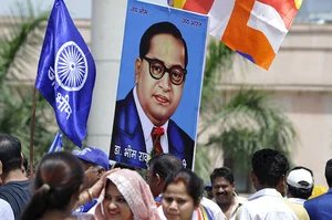 Photo by Sunil Ghosh via Getty Images : A portrait of BR Ambedkar with the flag of Bhim Army seen on the occasion of his 128th birth anniversary at Rashtriya Dalit Prerna Sthal, sector 95 on April 14, 2019 in Noida, India.