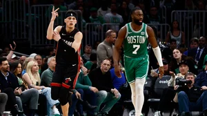 Tyler Herro #14 of the Miami Heat celebrates a three-point basket as he runs past Jaylen Brown #7 of the Boston Celtics during the third quarter of game two of the Eastern Conference First Round Playoffs at TD Garden on April 24, 2024.