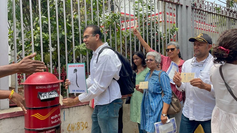 Civil society members send postcard to the ECI as part of 'Grow A Spine Or Resign' campaign in Bengaluru. - null