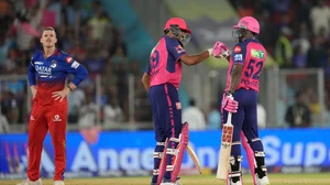 AP Photo/Ajit Solanki : Royal Challengers Bengaluru's Lockie Ferguson, left, reacts as Rajasthan Royals' Ravichandran Ashwin, center, celebrates with batting partner Rovman Powell after their win in the Indian Premier League eliminator cricket match against Royal Challengers in Ahmedabad.