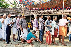 Photo: AP : The Wait to Vote: People queue up to cast their vote in Palakkad, Kerala, on April 26, 2024