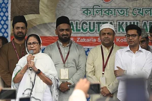 Samir Jana/Hindustan Times via Getty Images : West Bengal Chief Minister Mamata Banerjee speaks after Eid-ul-Fitr prayers, in the presence of nephew Abhishek Banerjee (R), at Red road on April 11, 2024 in Kolkata, India