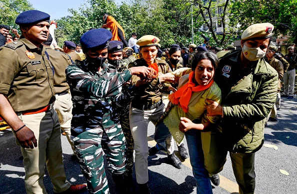 ABVP activists being detained by security personnel during protest against Mamata Banerjee government over Sandeshkhali case. - Getty Images