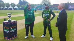Photo: X/ @TheRealPCB : Ireland captain Paul Stirling (L) and Pakistan captain Babar Azam (M) during toss time in the second T20I match.