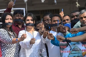 (Photo by: Abhisek Saha via Getty Images) :  Journalists from print and electronic media carried placards and wore black cloth tied on their mouths in a silent protest against the killing of journalist in Palestinian on International Day in support of Palestinian Journalists. (Representational Image)