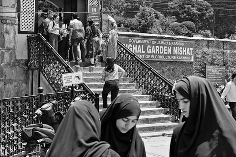Sights to Behold: Tourists and local visitors wait outside the Nishat Garden