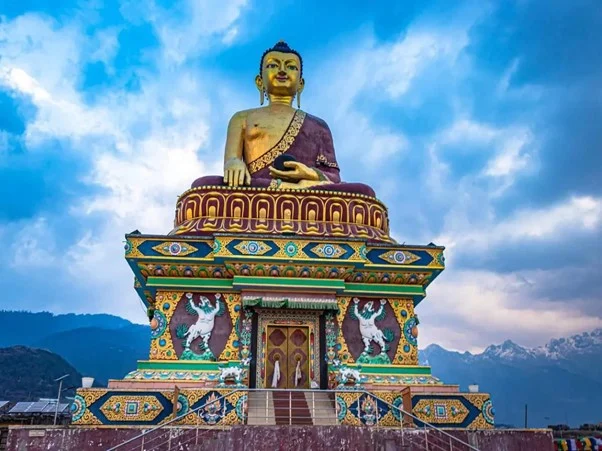 A serene Buddha statue stands before a majestic mountain, emanating tranquility and harmony.