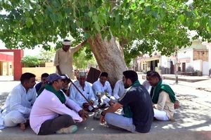 Photo via Tribhuvan Tiwari for Outlook : Farmers of Sirsa Discussing Elections