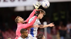 AP : Salernitana's goalkeeper Vincenzo Fiorillo challenges for the ball with Atalanta's Charles De Ketelaere during the Serie A soccer match between Salernitana and Atalanta.