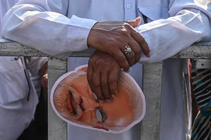  (Photo by Kabir Jhangiani Getty Images) : A man is holding a face mask of Indian Prime Minister Narendra Modi during a roadshow ahead of the Indian General Elections in Ghaziabad, Uttar Pradesh, India, on April 6, 2024.