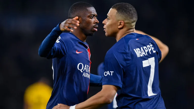 Kylian Mbappe (right) is tipping Ousmane Dembele to become the best player in Ligue 1. - null
