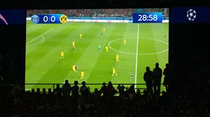 AP : Fans follow the game with a big screen on the background during the Champions League semifinal second leg soccer match between Paris Saint-Germain and Borussia Dortmund.