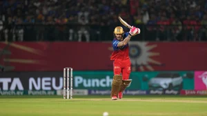 AP Photo /Ashwini Bhatia : Royal Challengers Bengaluru's captain Faf du Plessis plays a shot during the Indian Premier League cricket match between Punjab Kings and Royal Challengers Bengaluru in Dharamshala.